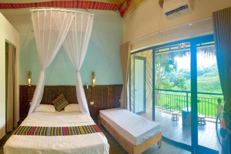 Pu Luong Ecostay - une chambre rustique avec vue sur les rizières en terrasses. Source : booking.com